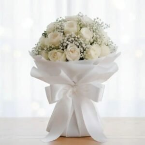 Handcrafted bridal bouquet featuring Fresh Roses & Baby's Breath in a sophisticated white floral arrangement.